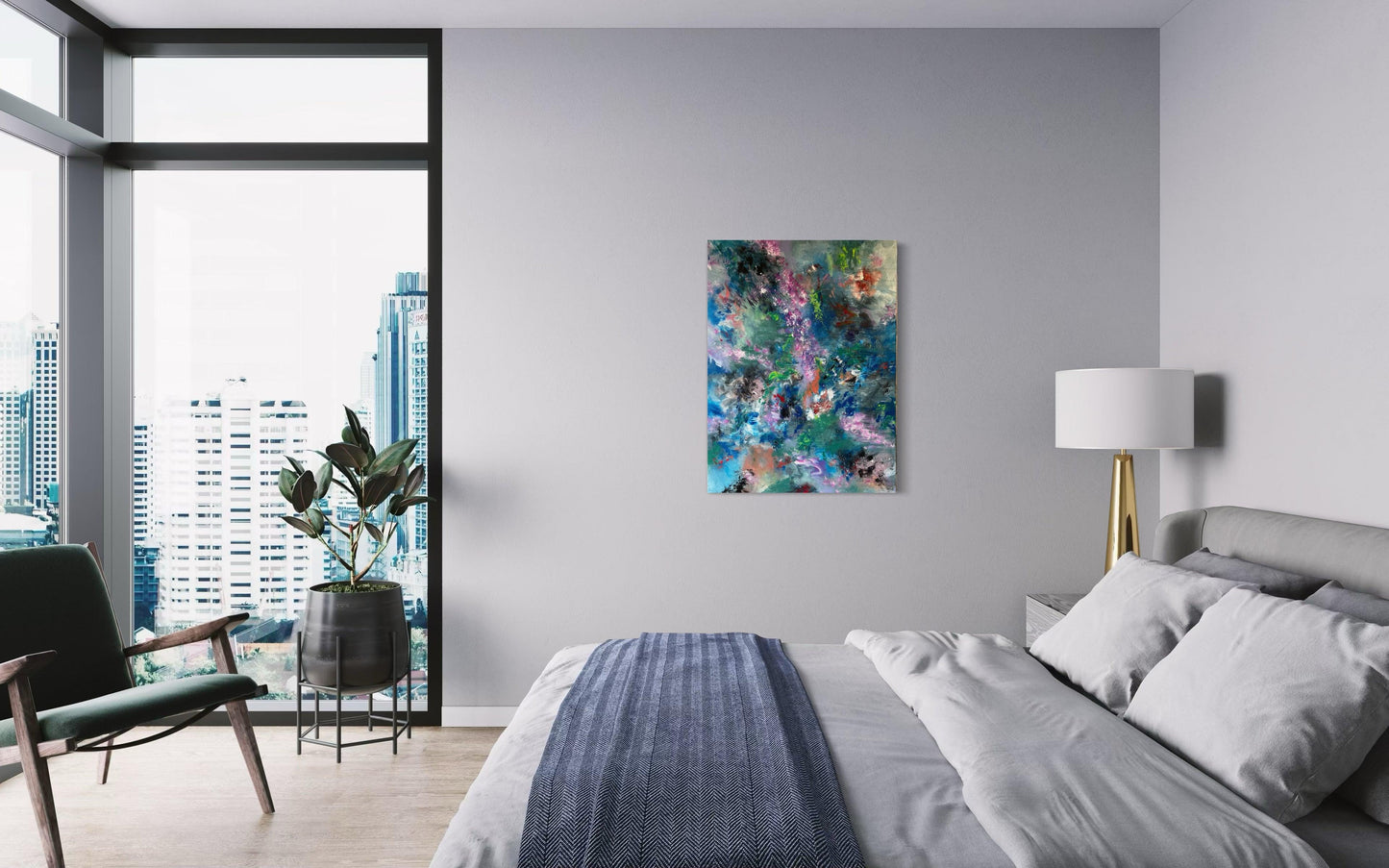 Pictured is the bedroom of an apartment high up, walls are pale grey and the flooring wooden. A large bed lies to the right of the photo with a pale grey duvet and white pillows the duvet is turned down showing the white underside. Along the base of the bed lies a dark blue/grey herringbone blanket folded across. A low chair snf rubber plant on a stand are at the foot of the bed. Floor to ceiling windows show the sky scrapers beyond. The chosen artwork is hanging on the wall directly in front.